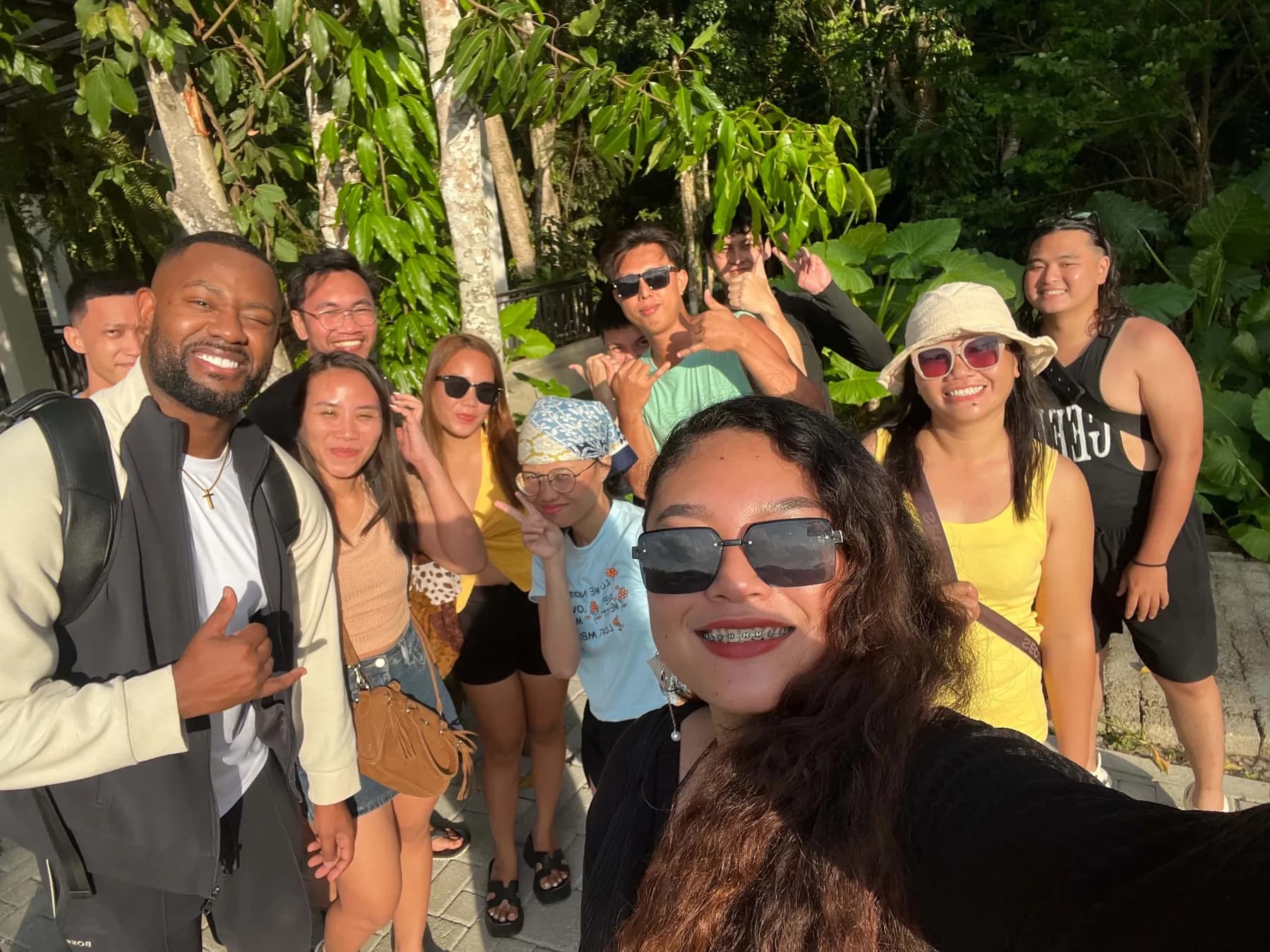 The MyThorneAI team smiling together in a tropical garden